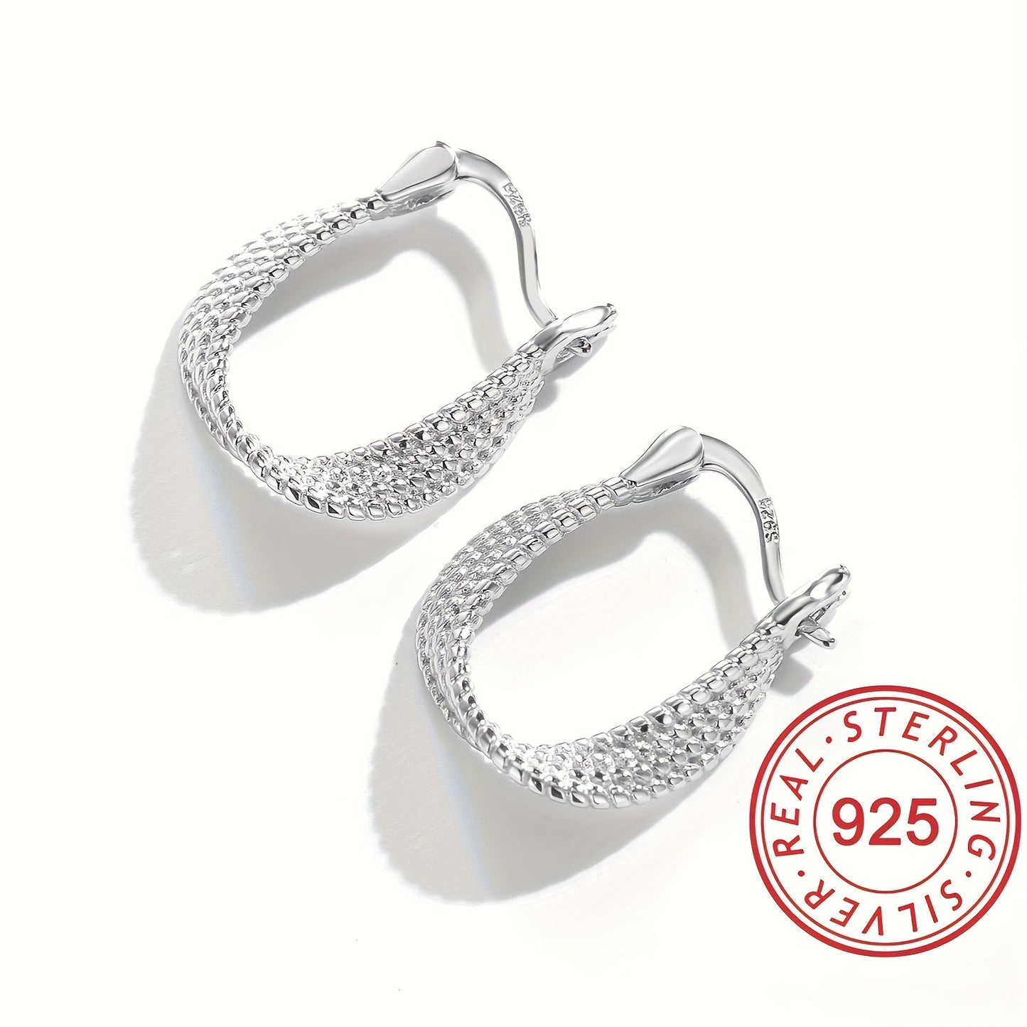 Classic and elegant, these twisted design hoop earrings are made of S925 sterling silver, making them hypoallergenic and perfect for sensitive ears. A timeless and exquisite gift for any woman.