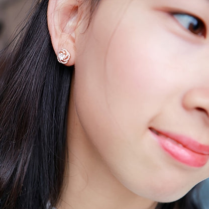 These dainty zirconia stud earrings are crafted from high-quality 925 sterling silver in a charming rose shape. Lightweight at approximately 2.1 grams, these versatile and lovely ear accessories are perfect for everyday wear.