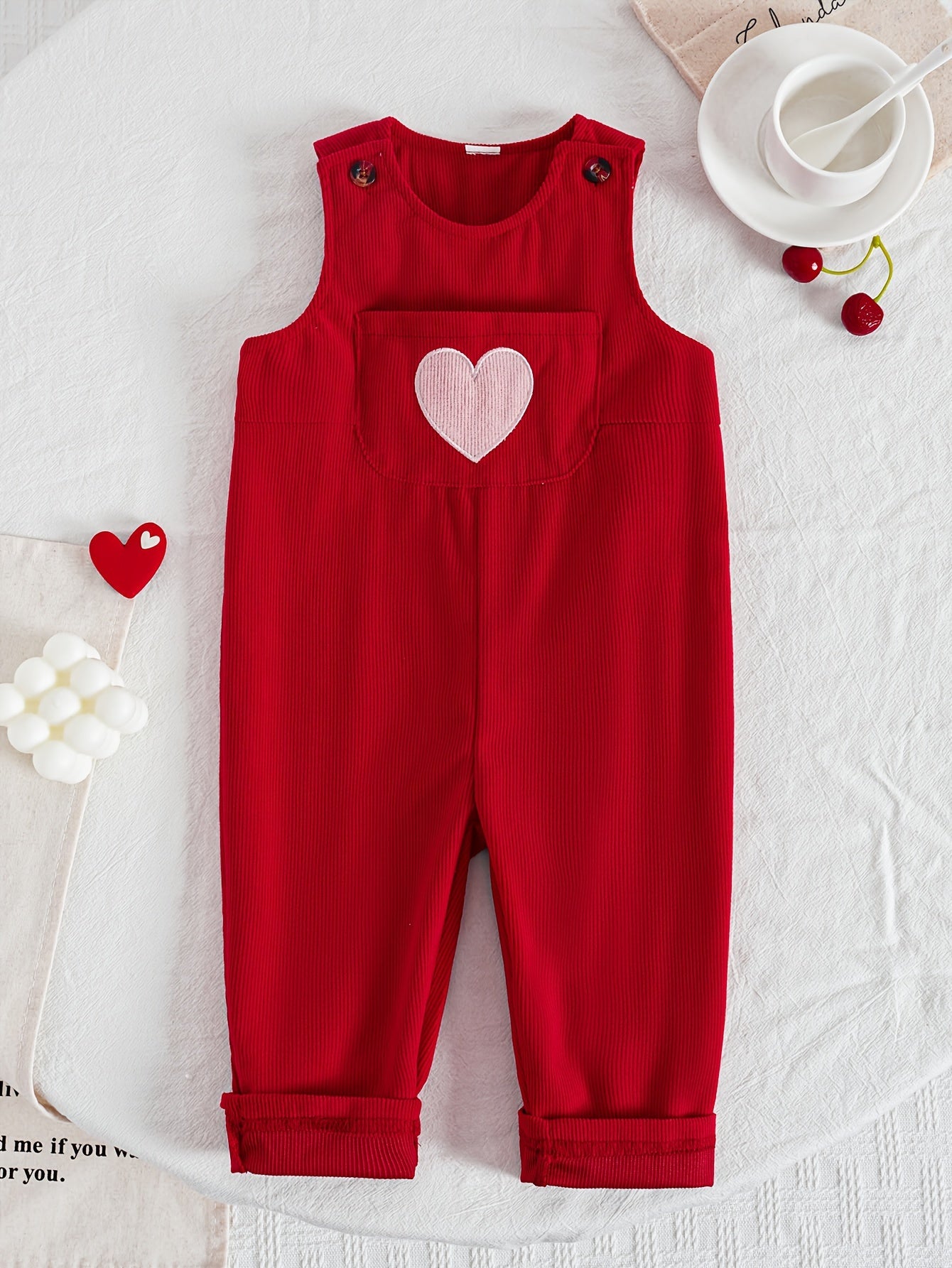 Cute red jumpsuit with heart embroidery for baby girls. Vintage-inspired, 100% polyester, machine washable. Great for autumn and winter outings.