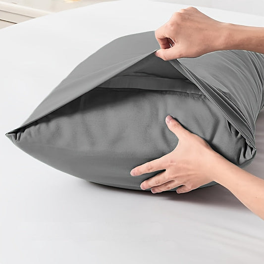 Set of two large pillowcases in gray and hidden blue colors, featuring an envelope style closure. Made from soft and breathable fabric, these pillowcases allow for a more comfortable sleep experience. Ideal for use in the bedroom, guest room, or as home