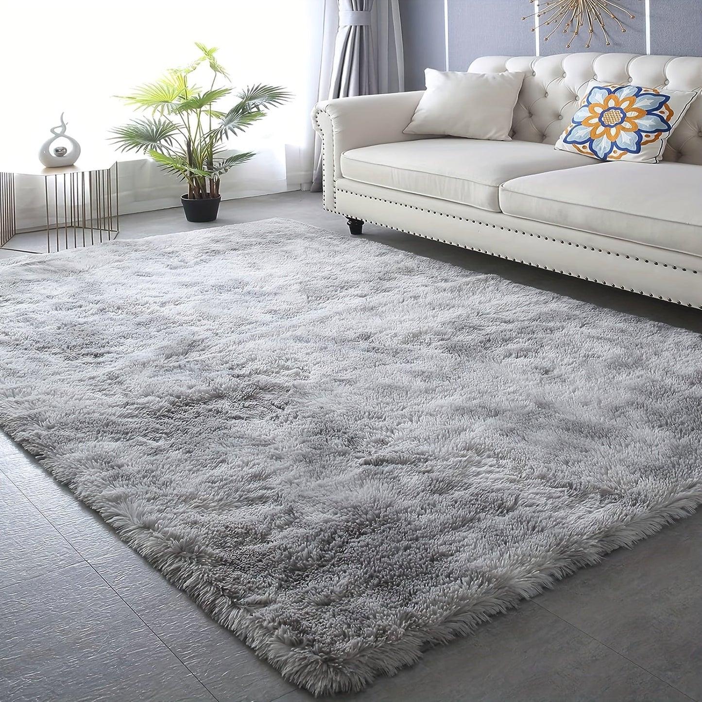 This high-quality plush shag area rug features a 5cm high pile and weighs 900g/sqm. It is machine washable and has a non-slip backing, making it perfect for use in bedrooms, living rooms, and offices. This rectangle polyester indoor carpet meets the