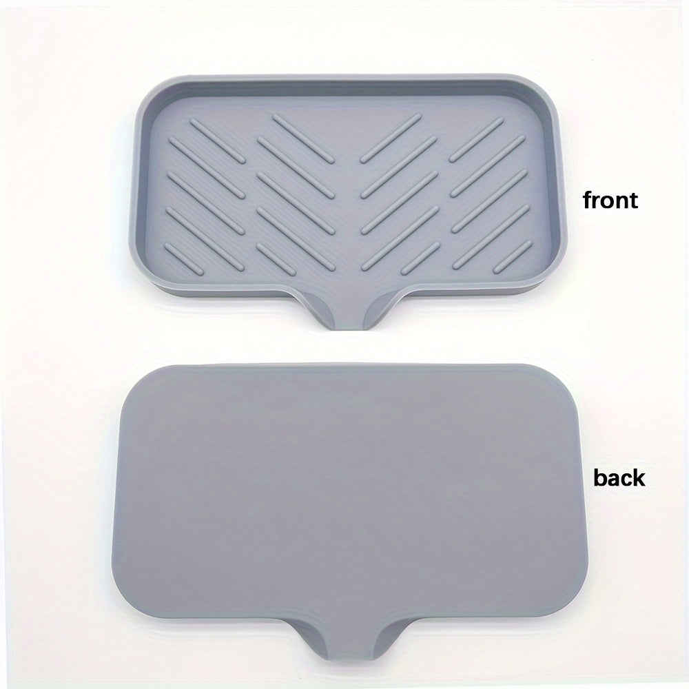 Silicone soap dish with self-draining tray for kitchen or bathroom sink, also functions as a non-slip sponge holder and soap saver pad.