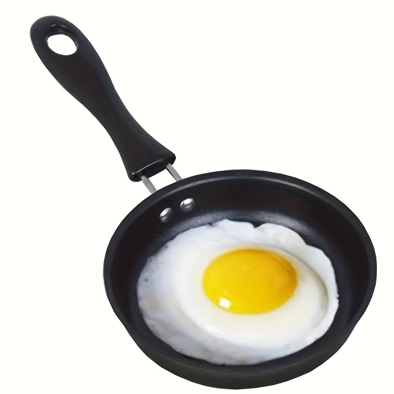 Mini non-stick frying pan, built to last with durable design. Perfect for cooking eggs and vegetables on the go, this portable skillet features a flat bottom for even heat distribution. Easy to clean and maintain, this cookware is thickened and designed