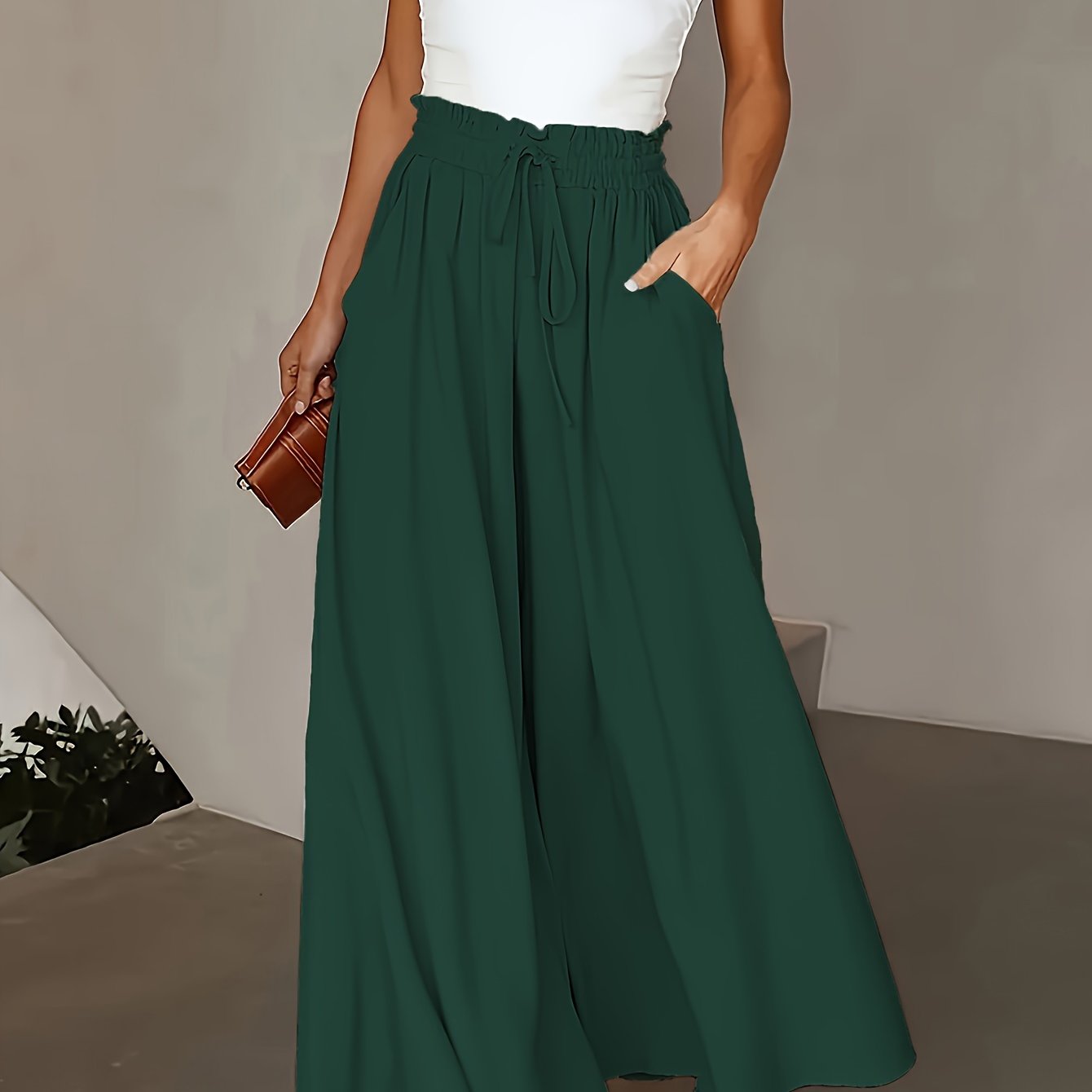 Olive green wide-leg pants for plus size women with high-rise and drawstring waist. Flowy straight cut, machine washable, comfortable for all seasons. Elegant casual style with smooth