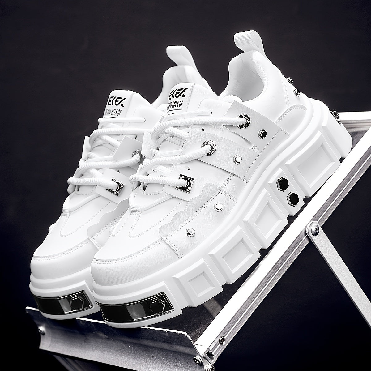 Chunky, punk-inspired sneakers with metal stud accents. Streetwear fashion statement in white, thick-soled trainers. Ideal for skateboarding, parties, and everyday wear. Unisex.