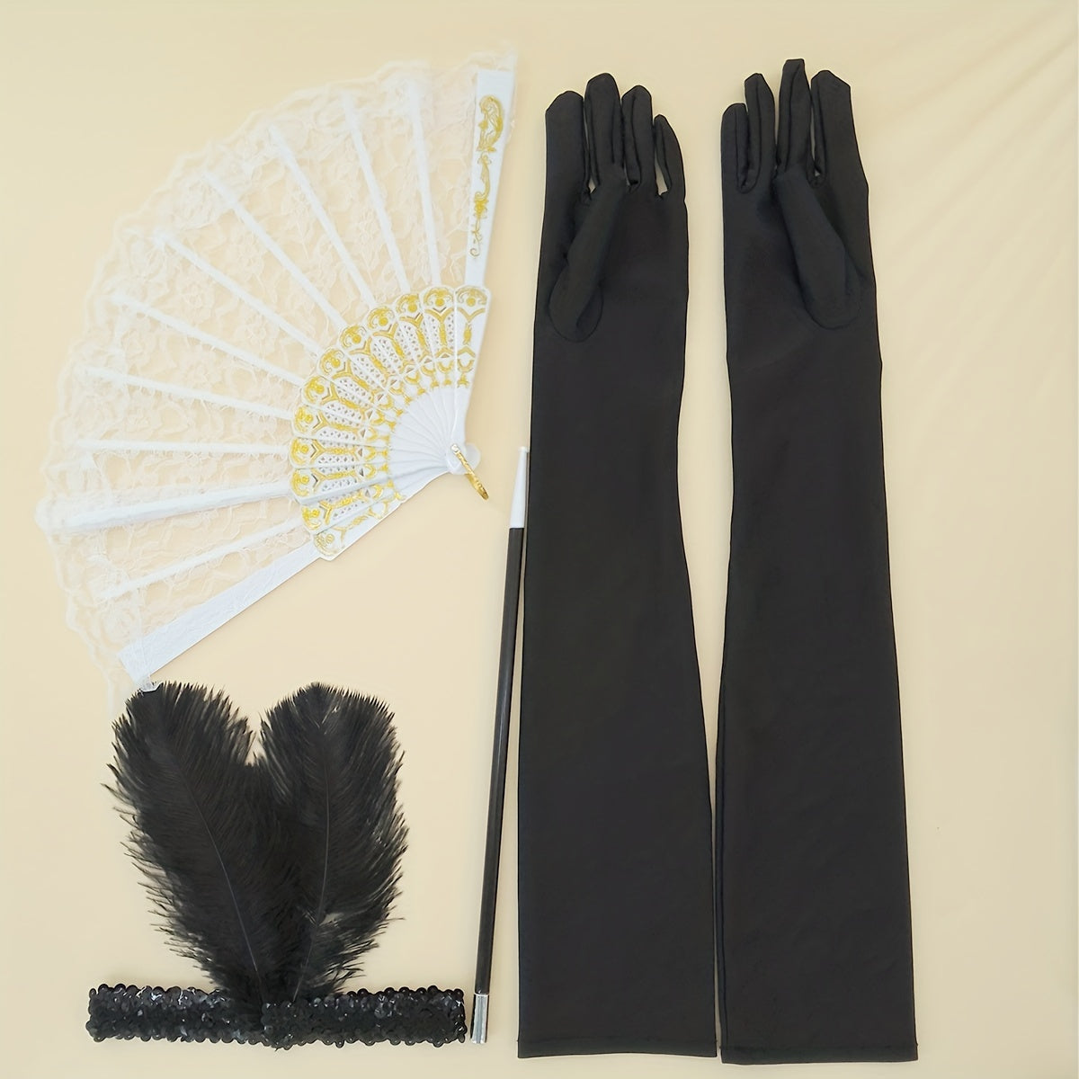 A collection of 1920s masquerade party accessories including gloves, faux feather hair clips, smoke tube fans, and other dress embellishments for women.