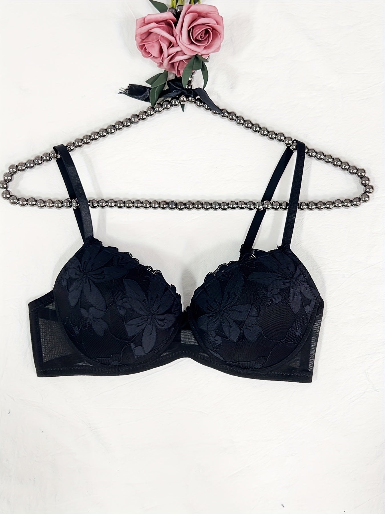 Floral embroidered lingerie set for women featuring a comfortable push-up bra, low-rise thong, mesh detail, and sexy triangle pant. Made with a nylon blend for breathability.