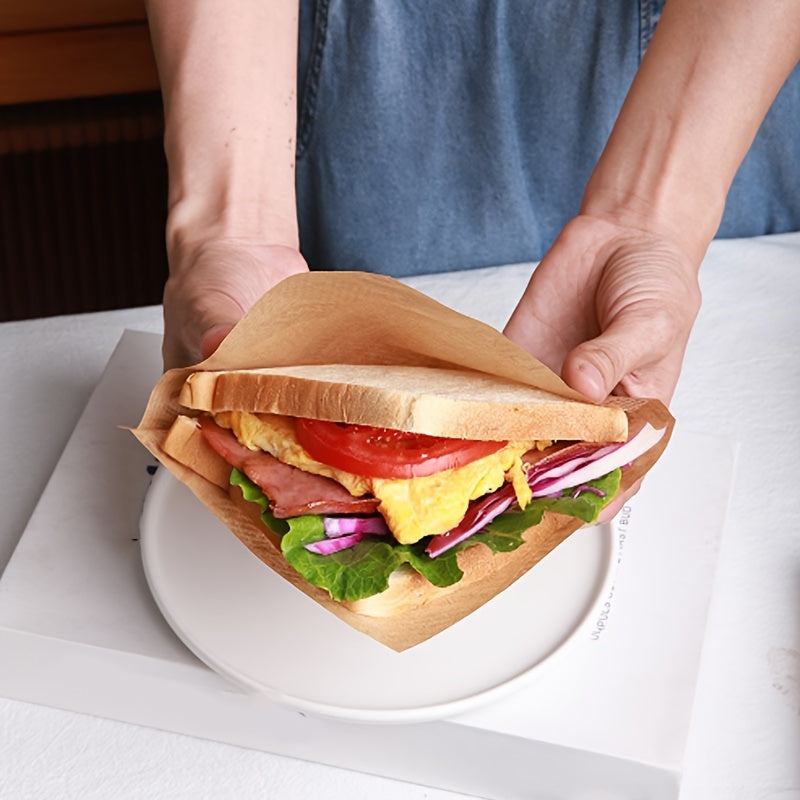 Pack of 100 oil-proof paper printed with food-safe text, ideal for lining food packaging for cooked meals such as hamburgers, sandwiches, cheese, perfect for picnics, parties, baking, cooking, and frying. The waterproof paper provides protection and