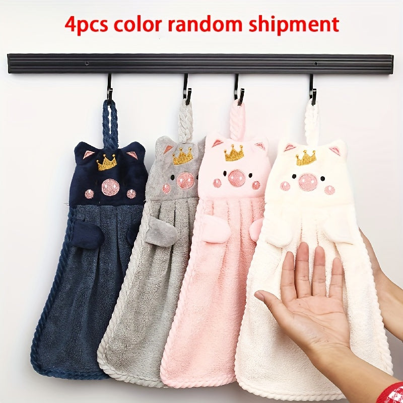 2 cute piggy hand towels made of super absorbent coral velvet with crown design. Includes hanging suction cups for easy display. Fun and whimsical bathroom or kitchen decor.