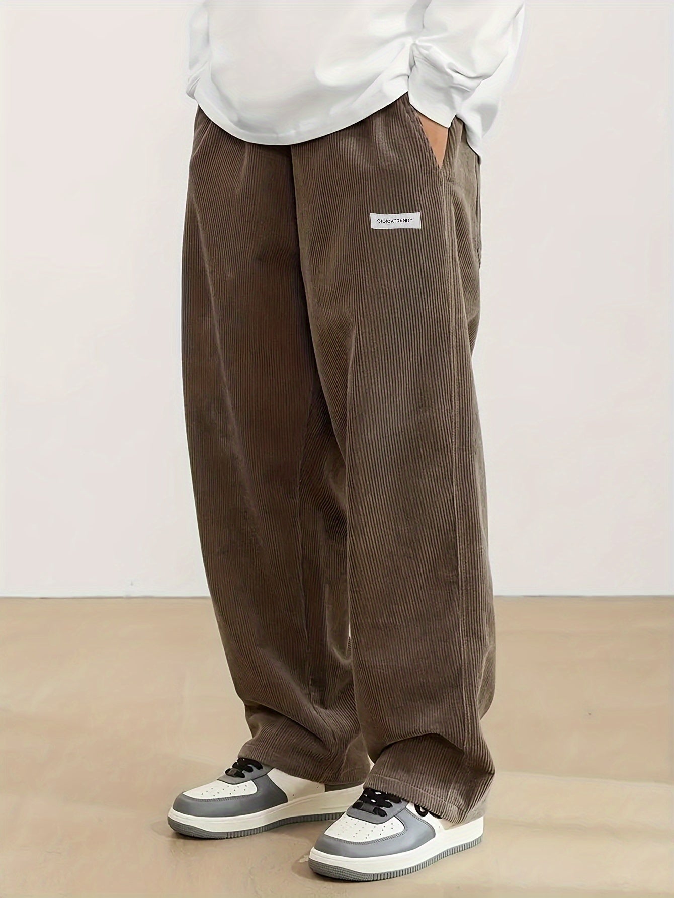 Men's casual corduroy pants with drawstring waist, ideal for outdoor activities and commuting.