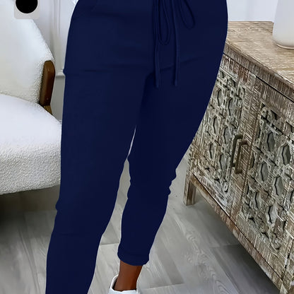 Women's plus size solid color straight leg pants with pockets, drawstring, and relaxed fit for casual wear.