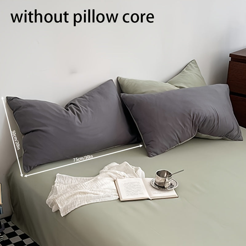 Get two ultra-soft brushed polyester pillowcases, weighing 90g each in a sleek light purple color. These rectangular pillowcases measure 50.8x76.2cm and feature an envelope closure. They are machine washable and perfect for adding cozy comfort to your