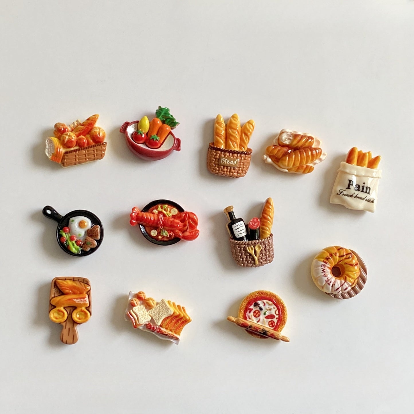 Set of 12 adorable French baguette, toast, and egg tart refrigerator magnets - perfect for adding a touch of charm to your kitchen, office cabinets, or dishwashers. These cute miniature magnetic food decals are ideal for holding photos and notes, adding