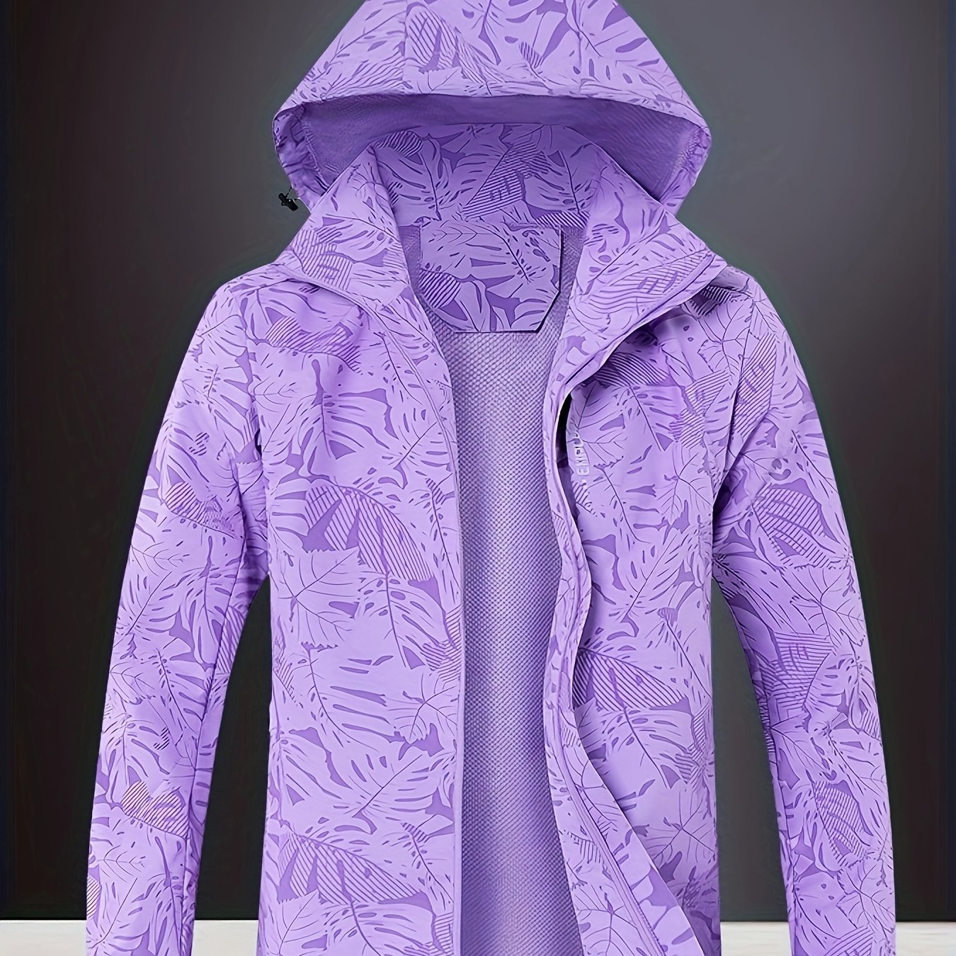 Women's outdoor sports jacket with water-resistant and windproof features, detachable hood, and zipper closure.