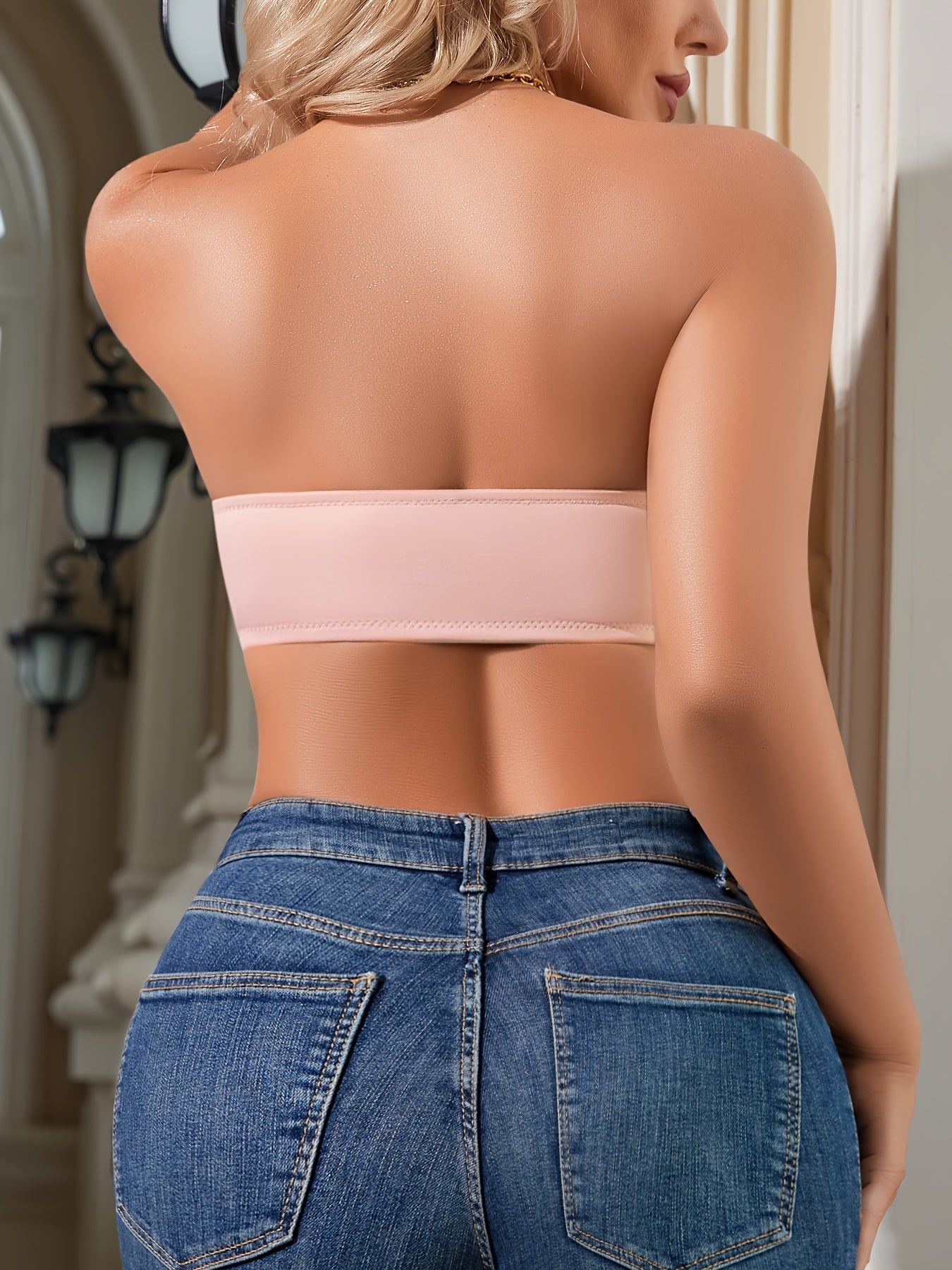 Smooth light pink bralette with elegant front closure, non-slip grip, wireless and padded, made from breathable nylon/elastane blend, machine washable.