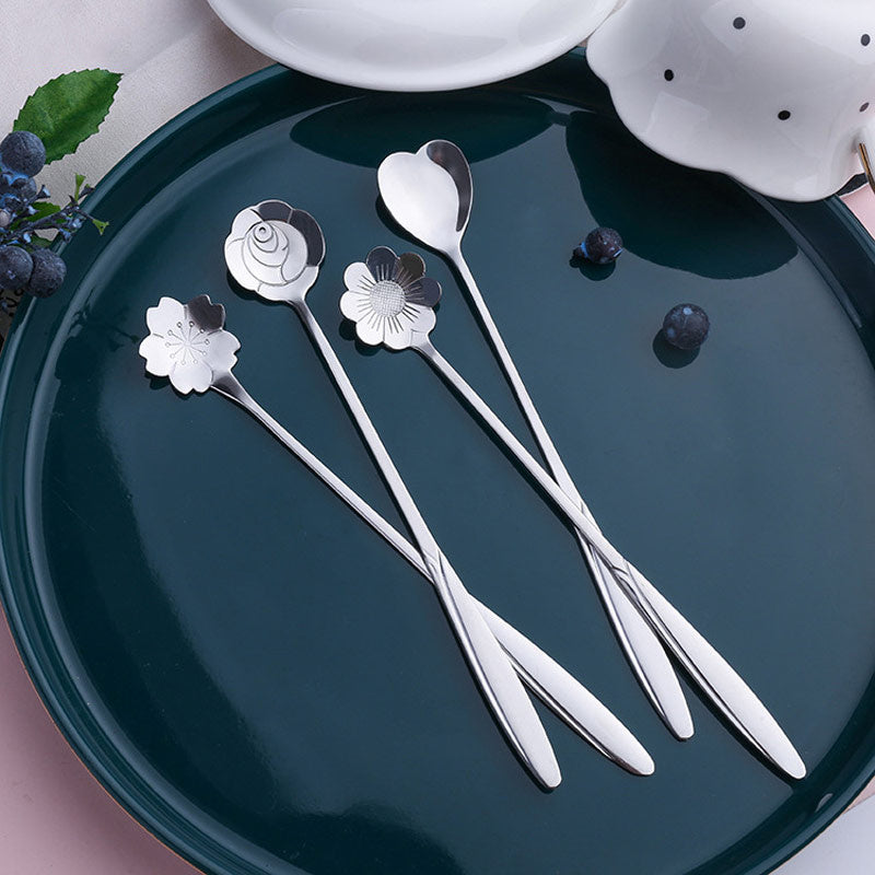 Four stainless steel cherry blossom coffee/dessert spoons.