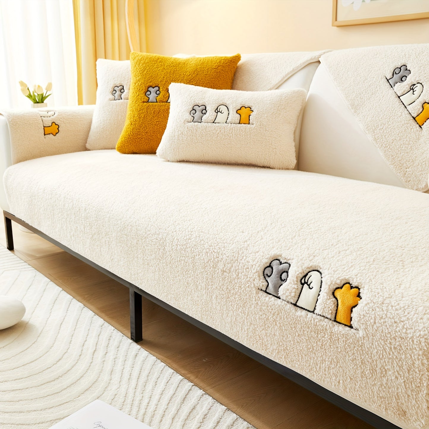 Modern plush sofa cover with paw pattern embroidery, non-slip protection for sofas, machine washable and suitable for various types of furniture.