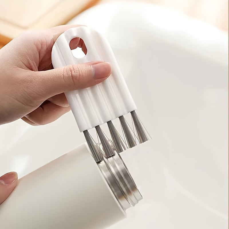 Multi-function keyboard cleaning kit with soft brush, duster, and keycap puller.