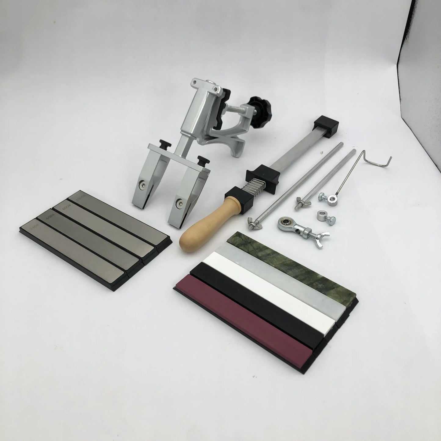 Upgrade your woodworking tools with the 2023 XT Fixed Angle Knife Sharpener Set. This professional kitchen sharpening system features diamond stones, metal construction, manual operation, and a non-electric grit size for precision sharpening.