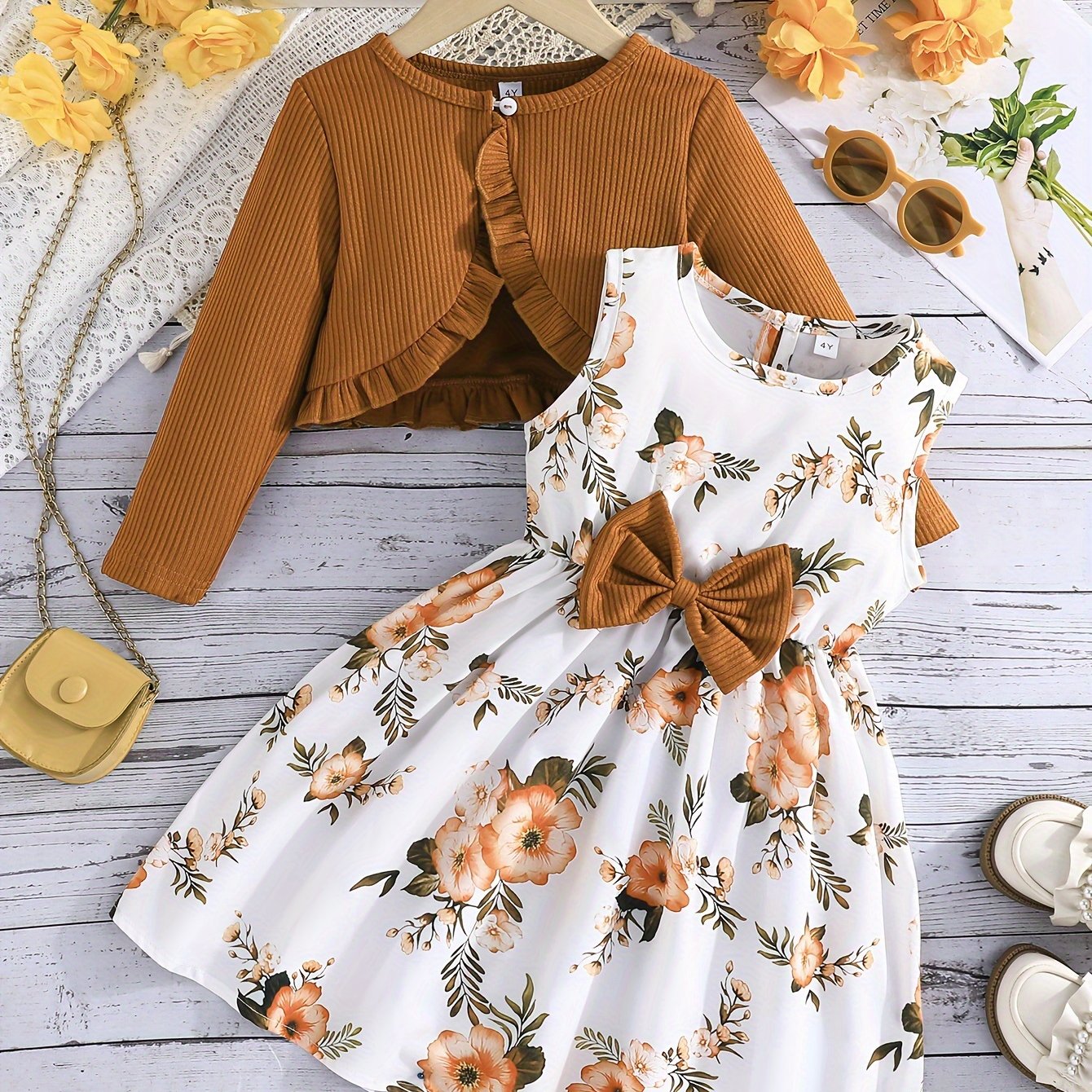 Girl's 2-piece outfit: Sundress with bow and floral pattern + Ruffle cardigan top. Casual wear for spring/fall, perfect for outdoor activities.