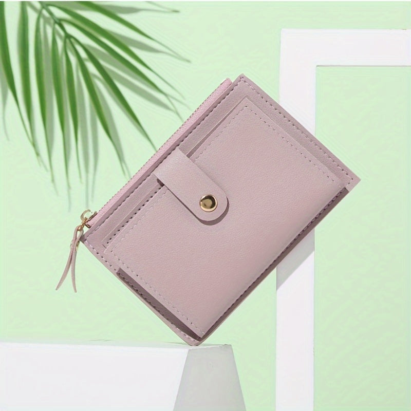 Sleek women's wallet with snap button zipper in pink, light brown, blue, and black. Lightweight, portable, bifold design made of TSA-approved PU material. Ideal for cash, ID, credit cards