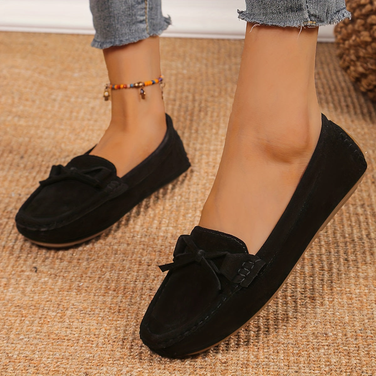 Retro flat loafers with bow detail, slip on style, and soft sole for casual wear.