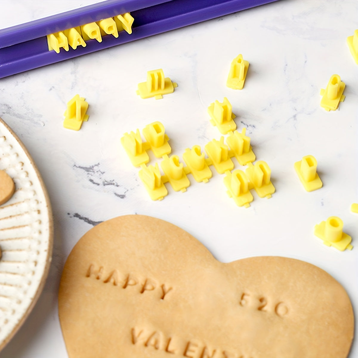 Cookie stamps that are interchangeable, along with a mini alphanumeric cookie cutter, alphabet and numbers cookie embosser, cake and candy decorating tools, and DIY kitchen baking tools.