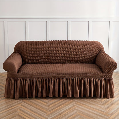 Seersucker skirt sofa cover protects couch from cat scratches in bedroom, office, or living room.