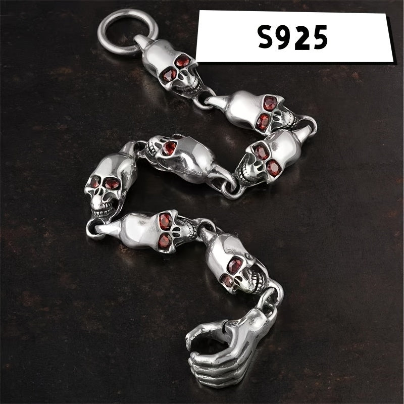 Vintage-inspired 925 sterling silver Gothic skull bracelet featuring a striking red eye charm. This adjustable punk style jewelry is ideal for couples and is perfect for daily wear and music festivals.