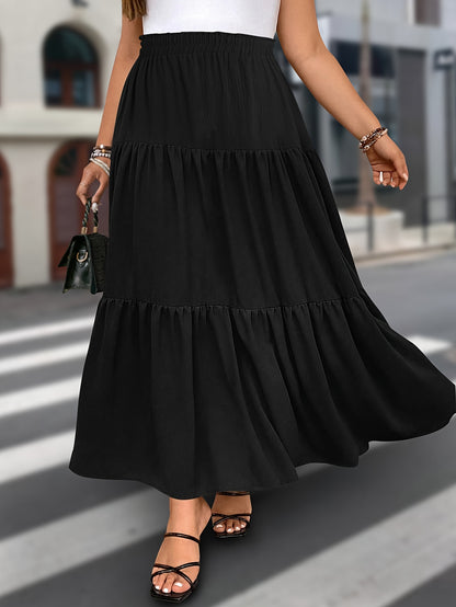 Stylish black midi skirt with ruffle detail, elastic waist, and versatile design. Made from a polyester blend, machine washable and perfect for spring/summer fashion.