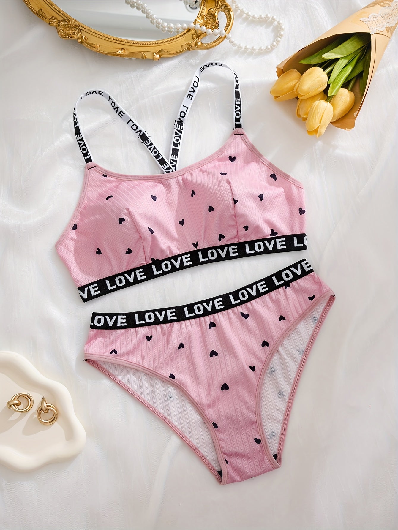 Women's sexy heart print lingerie set made from polyester knit fabric with LOVE strap detail, braid accent. Adult intimate apparel.