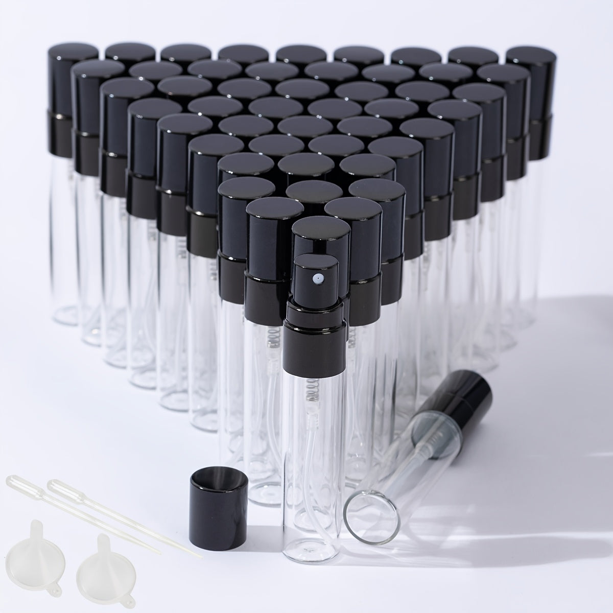 50 transparent glass bottles for decanting 5ml and 10ml perfumes, with spray tops.