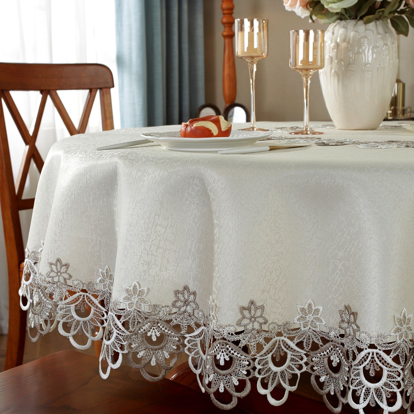 Polyester round tablecloth with lace border, ideal for various occasions in multiple sizes.