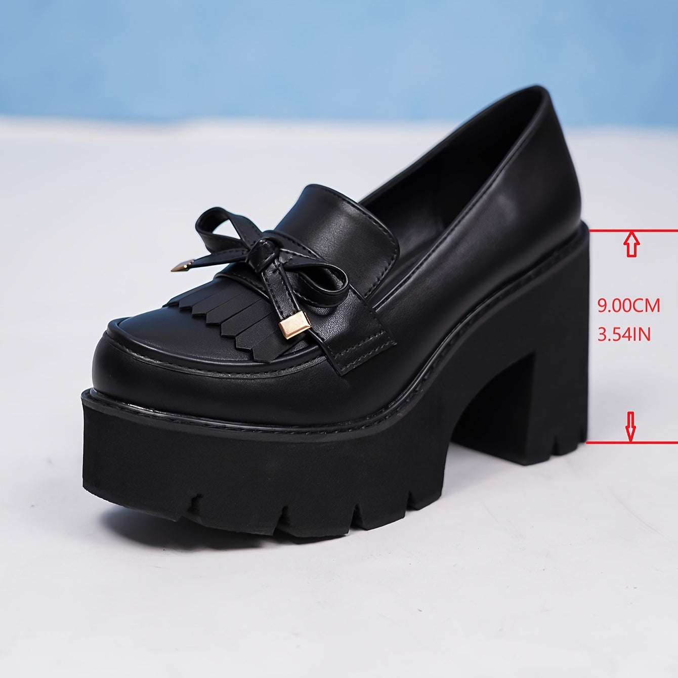 Black platform pumps for women with bow accent. Round toe, high heel shoes with lightweight rubber sole. All-season comfort with man-made materials.