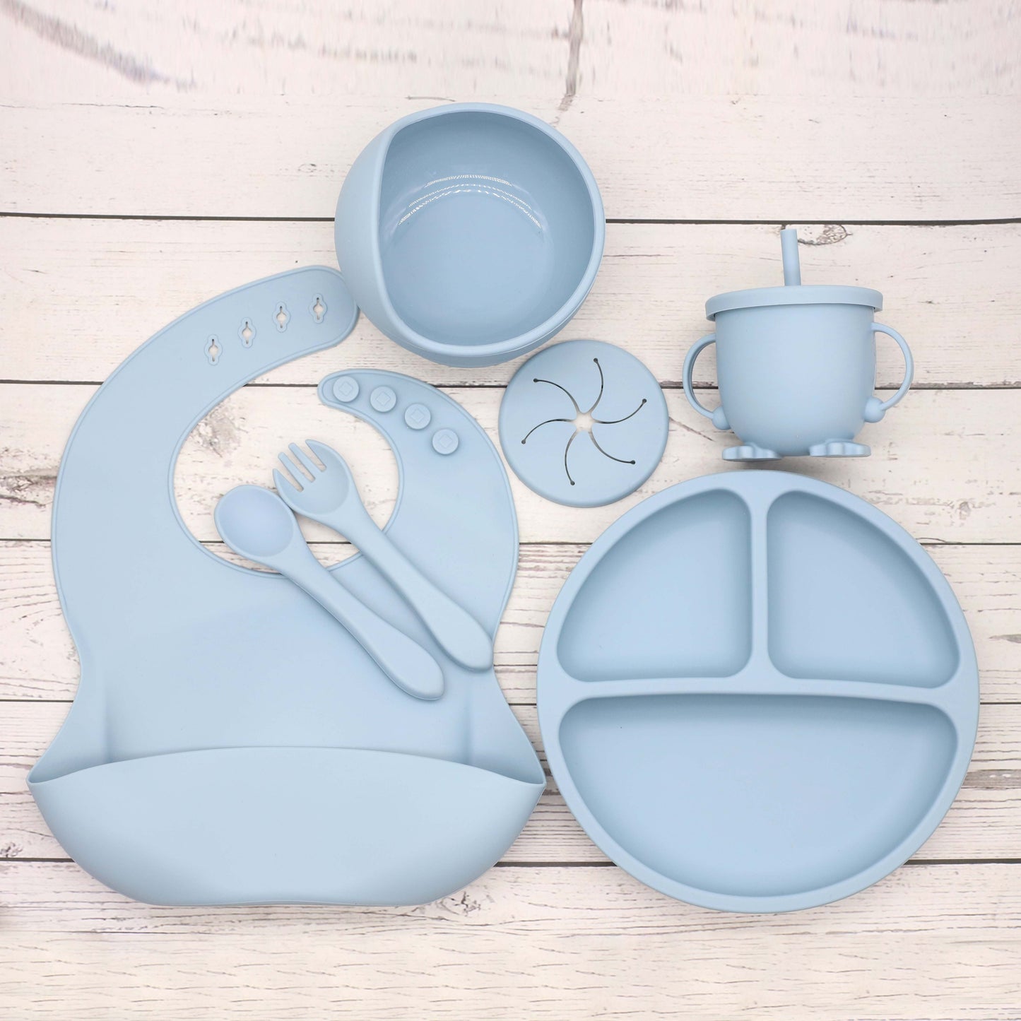 6 piece set of Silicone Feeding Items, featuring a Silicone Bib, Silicone Suction Plate, Silicone Suction Bowl, 2-in-1 Drinking Training Cup. Made of soft and safe, food-grade silicone that is BPA-free. Perfect Easter gift idea.