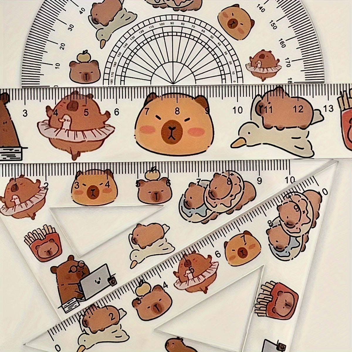 One set of 4 plastic transparent Capybara-themed rulers for drawing tests, including a triangle ruler board. Cute kawaii stationery for school supplies.