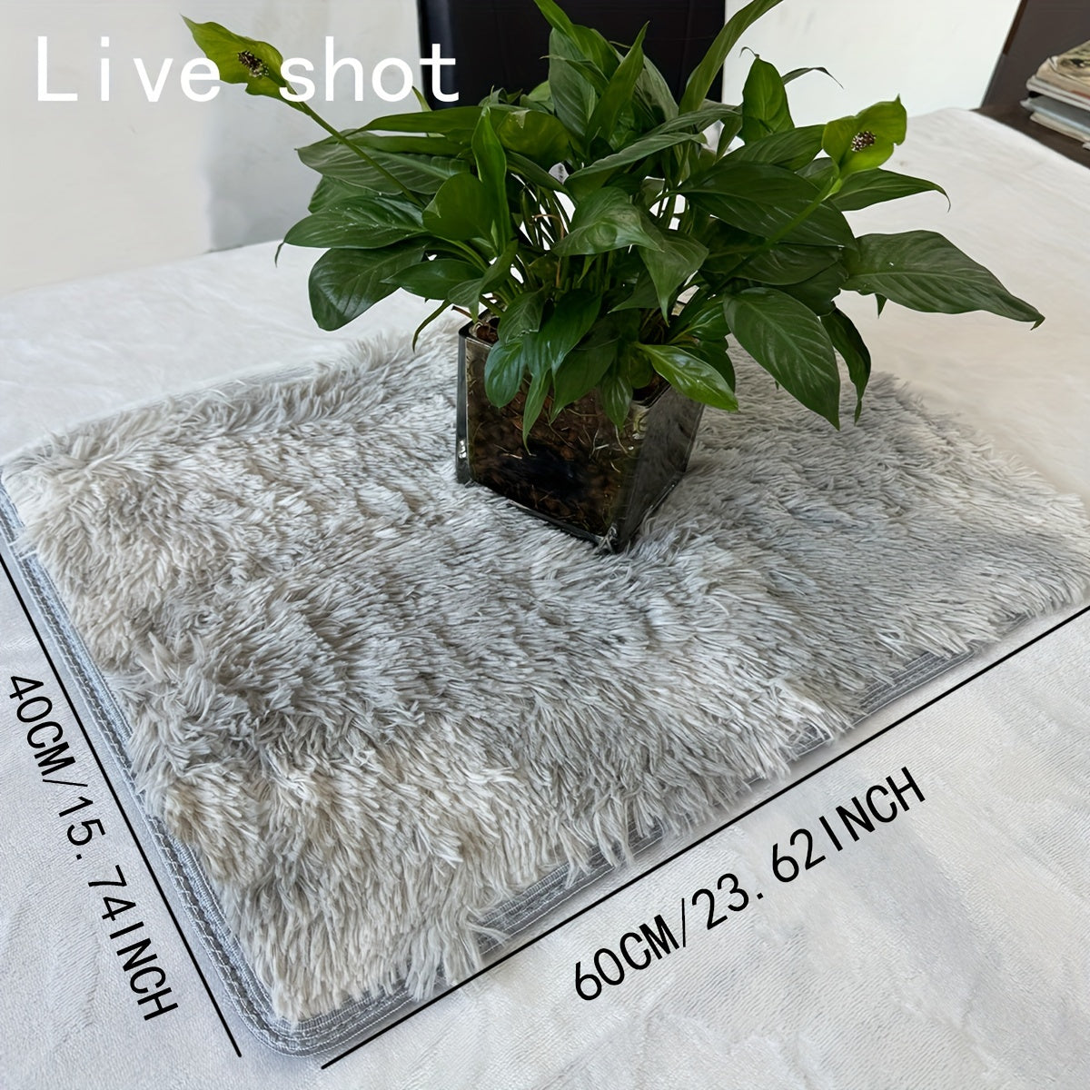 Soft and cozy shaggy area rug perfect for bedroom or living room decor. This plush light gray rug measures 160.02cm x 80.01cm and features a rectangular tie-dye design. Made of machine-washable polyester, this rug is ideal for dorm rooms and homes. Add a