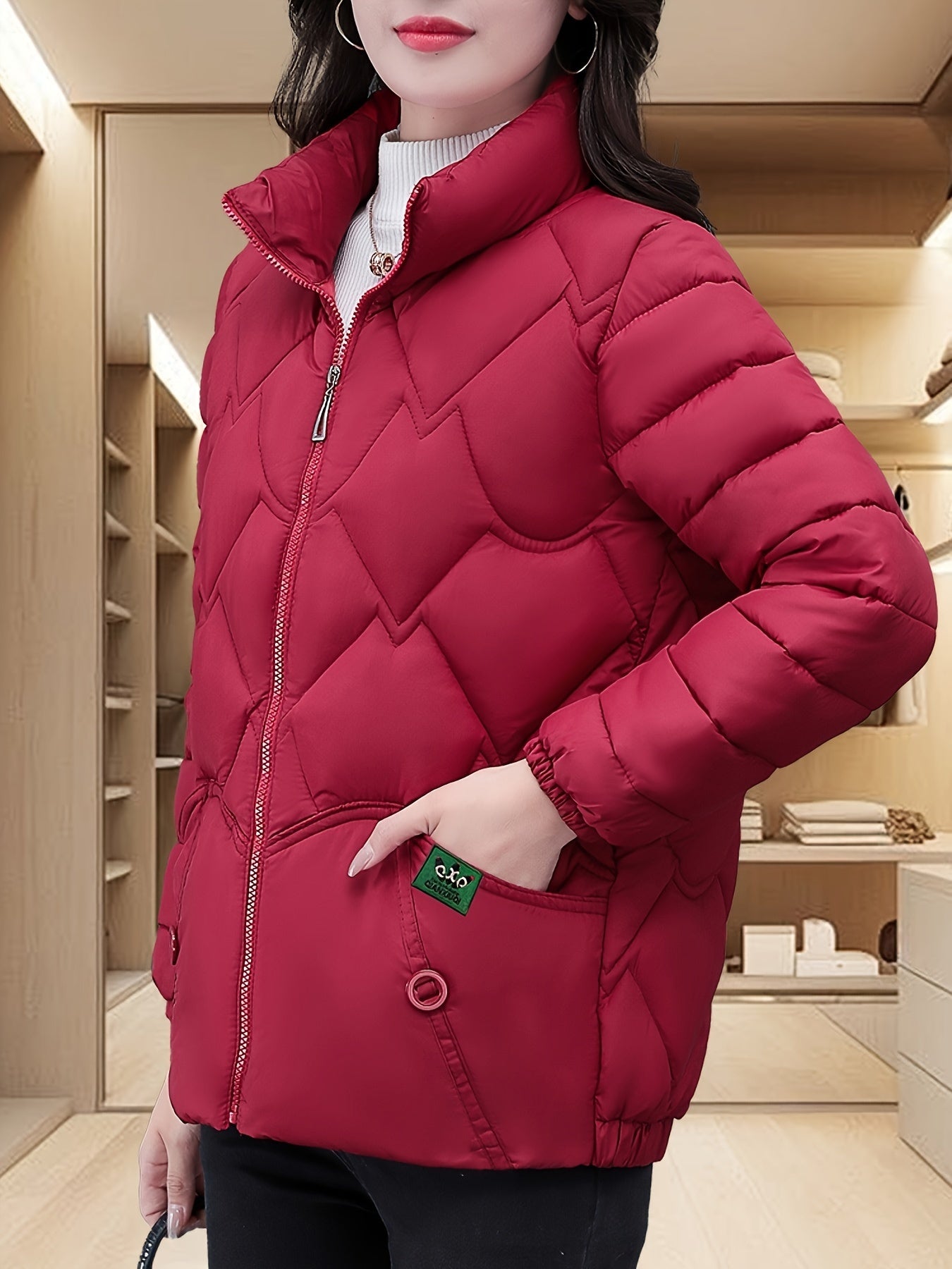 Embroidered quilted jacket for middle-aged moms with pleated hem and thick insulation for warmth.