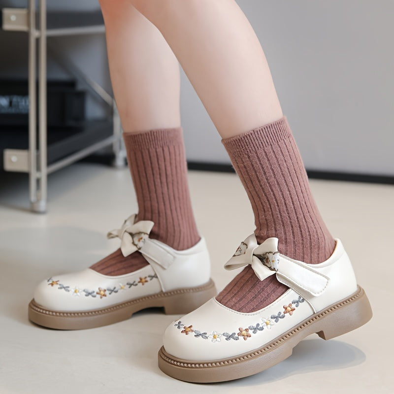 Girls' Mary Jane shoes for Fall 2024, featuring an elegant princess style with floral embroidery and bow detail. Non-slip rubber sole, hook-and-loop strap closure for school, parties, or