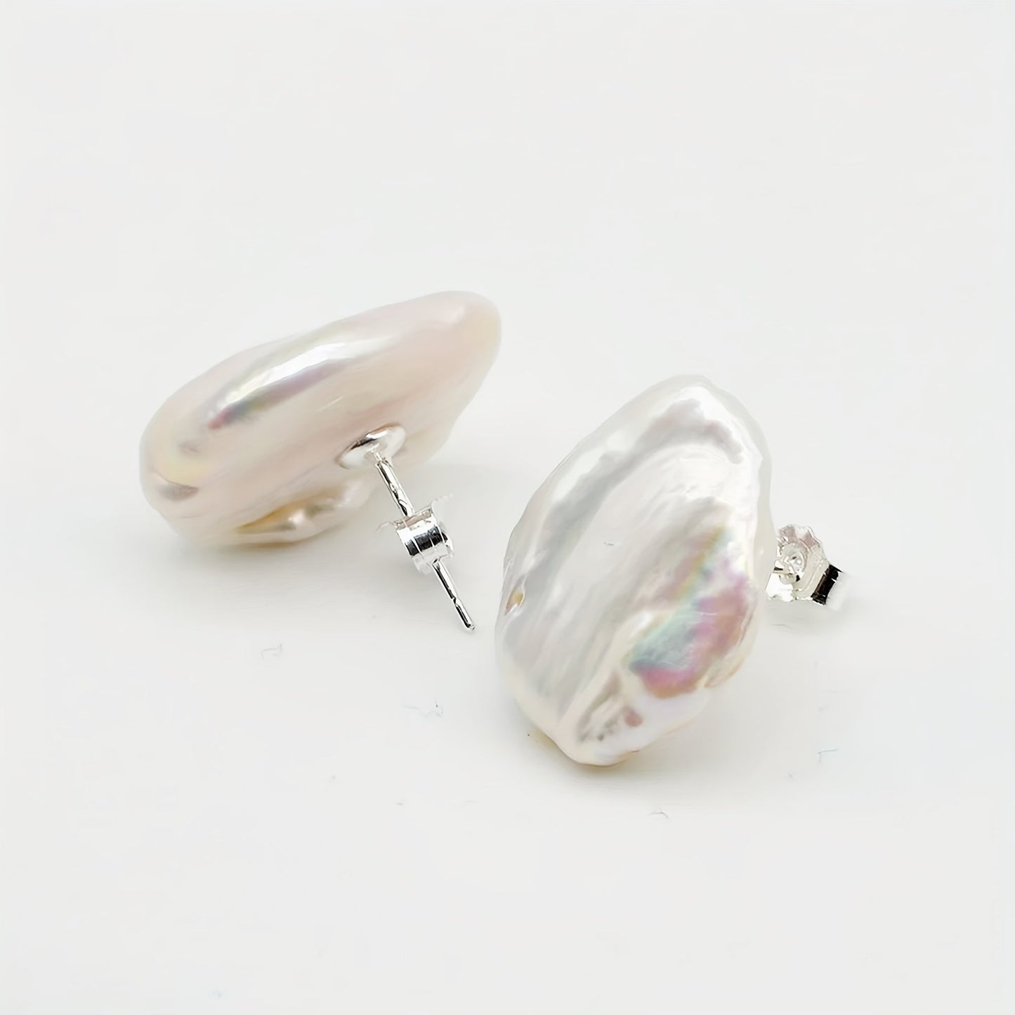 Baroque Pearl Earrings for Women by SAUDADE, featuring Natural Freshwater Pearls set in Silver Plated metal. These earrings boast a simple yet elegant style, making them the perfect gift for both daily wear and Mother's Day. With their timeless design