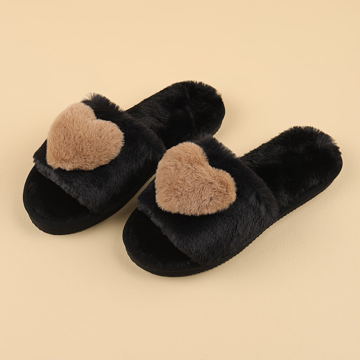 Warm and cozy women's plush slippers with heart accent for indoor comfort and style.