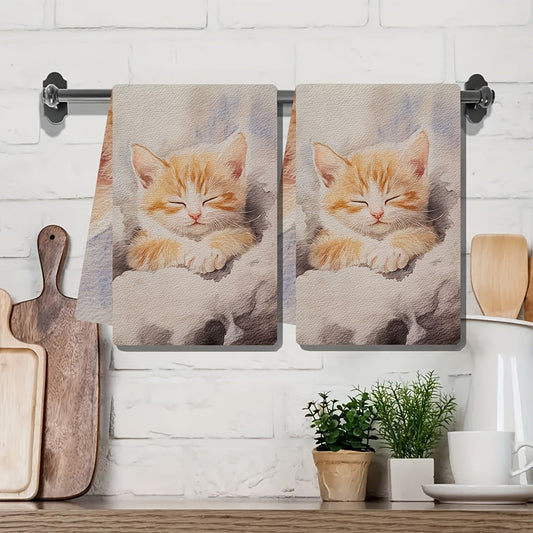 Two pieces of ultra soft kitchen towels featuring a charming kitten design. These highly absorbent towels are machine washable and perfect for use as dish hand towels. They are ideal for adding a festive touch to your holiday decor. Each towel measures