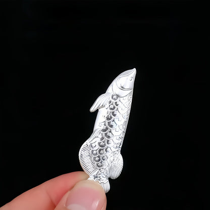 1 piece of silvery tea ceremony accessories for making tea and boiling water, a silvery dragon fish tea pet, and a silvery leaf for sterilizing and softening water quality.