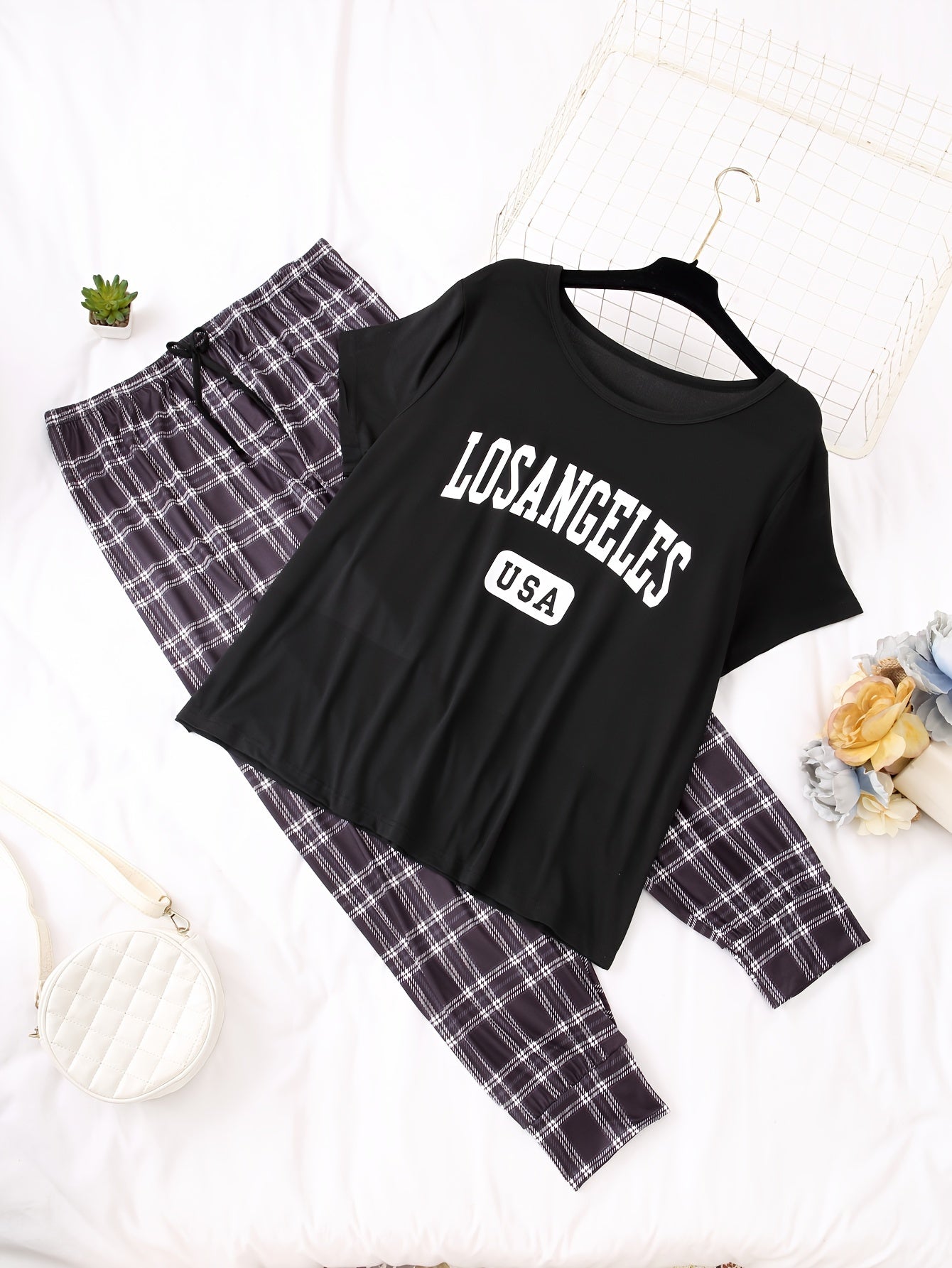 Women's casual pajama set with alphabet pattern, color block design, made of polyester knit fabric with elastane. Includes short sleeve top and long pants loungewear for fall season.