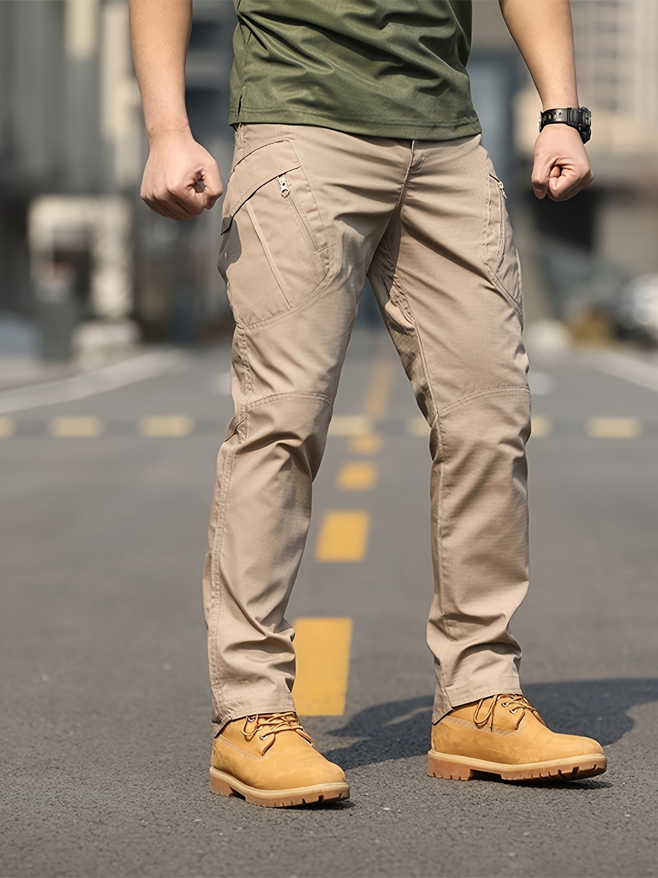 Men's olive green tactical cargo pants made of durable polyester with multiple pockets, perfect for hiking and outdoor adventures. Machine washable and ideal for camping gear.