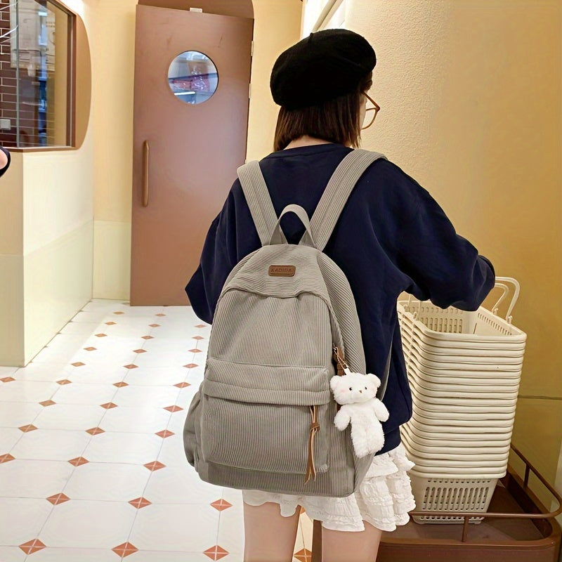 Large capacity women's corduroy backpack with cute bear pendant, ideal for high school and junior high.