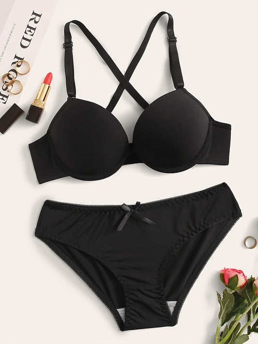 Push-up lingerie set for women, with underwire bra and high-waist panties. Nylon blend, available in black, white, and red.