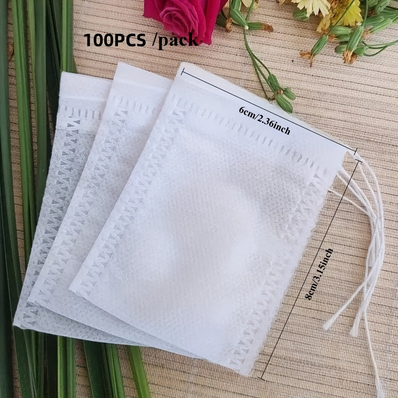 A bundle of 100 tea bags made from nonwoven material, complete with drawstrings, perfect for loose leaf tea, herbs, and spices. Comes in various sizes (6cm x 8cm, 7cm x 9cm, 8cm x 10cm).