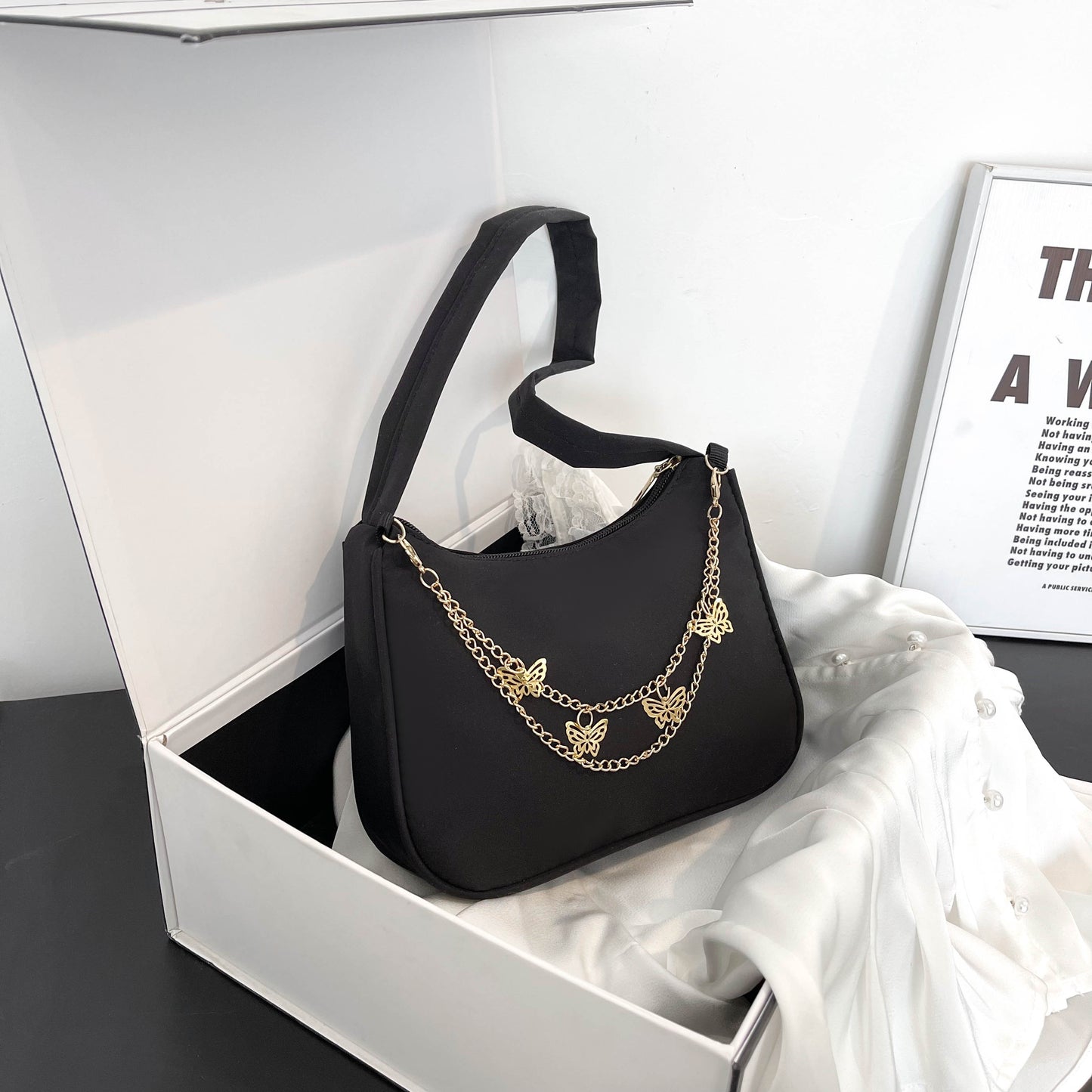 Stylish shoulder bag with butterfly chain, perfect for vacations, holidays, and parties.