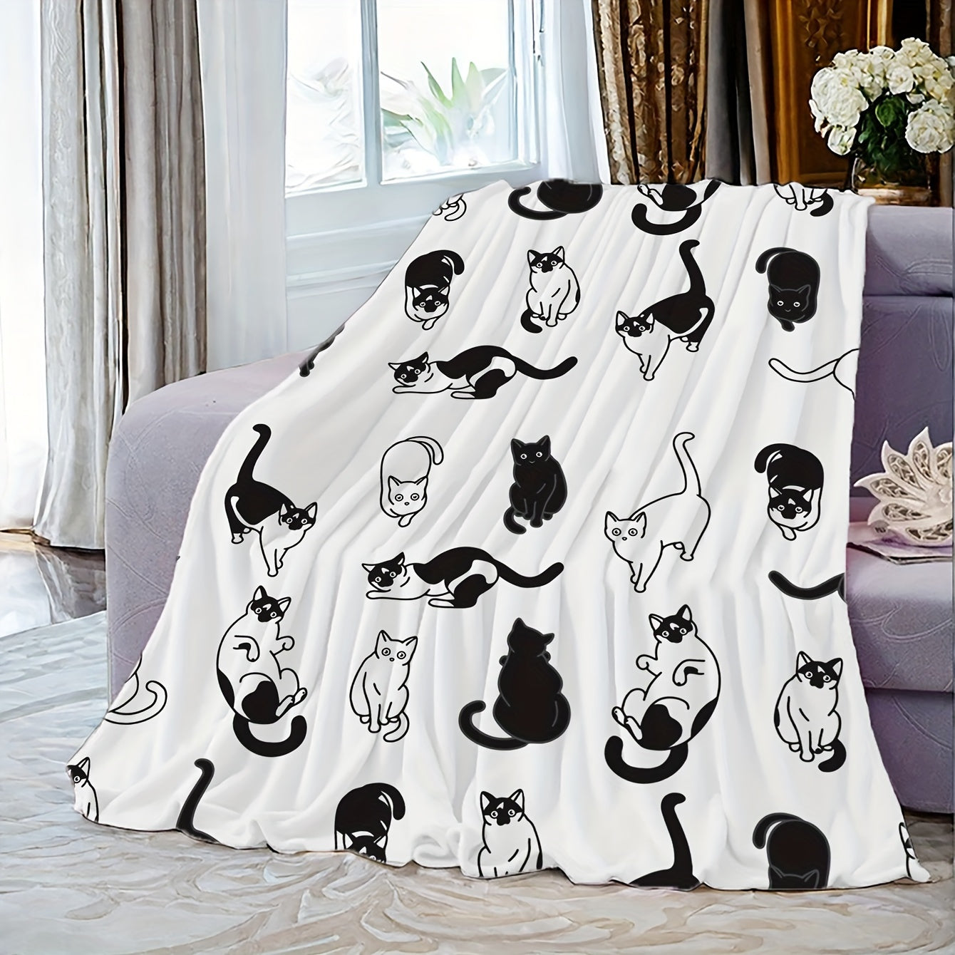 Soft and cozy fleece throw blanket featuring an adorable cartoon kitty print. Perfect for all seasons, this blanket is suitable for home, office, camping, and travel. Made from durable polyester fabric, it is machine washable for easy care. With a